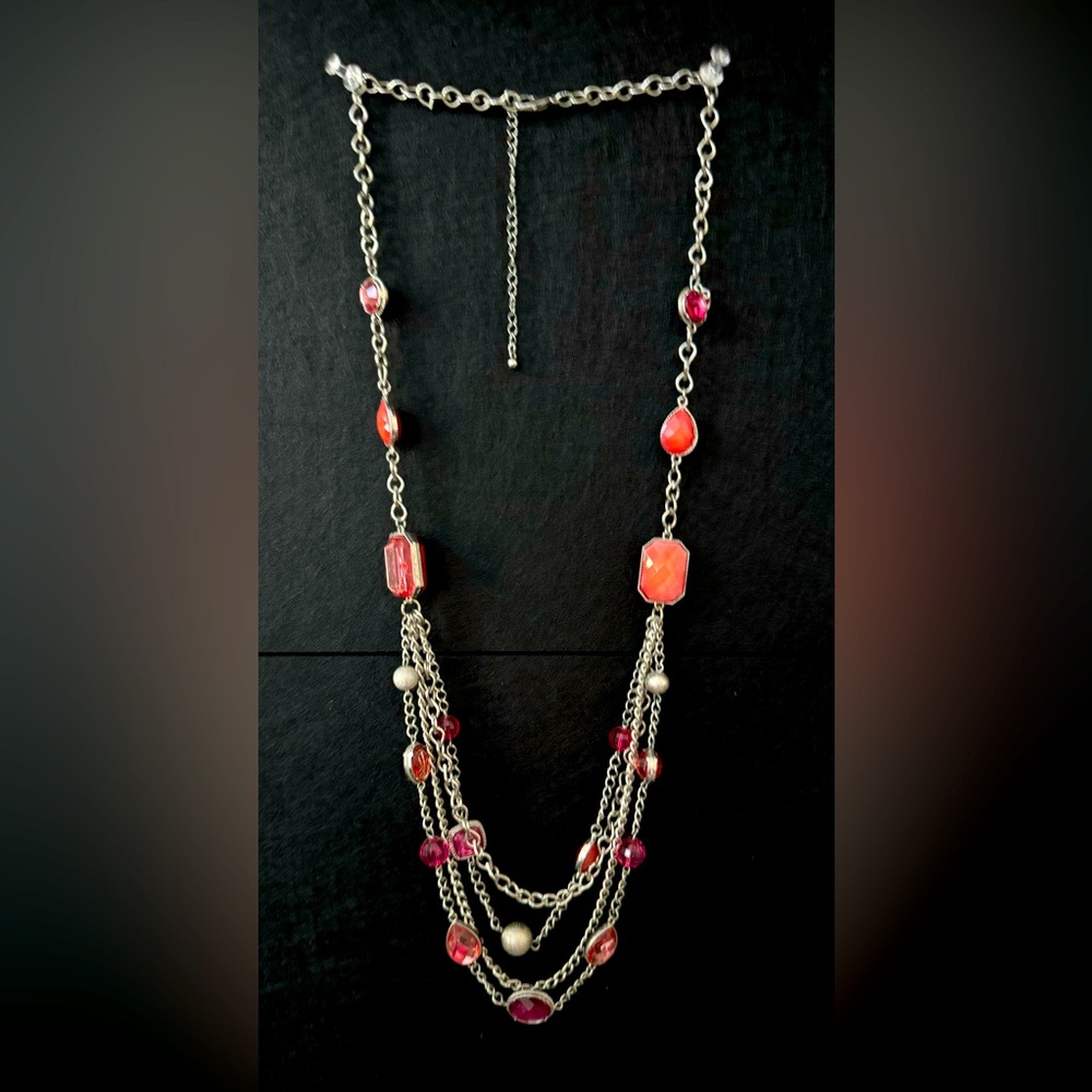 Long silver layered necklace with pinks and peaches